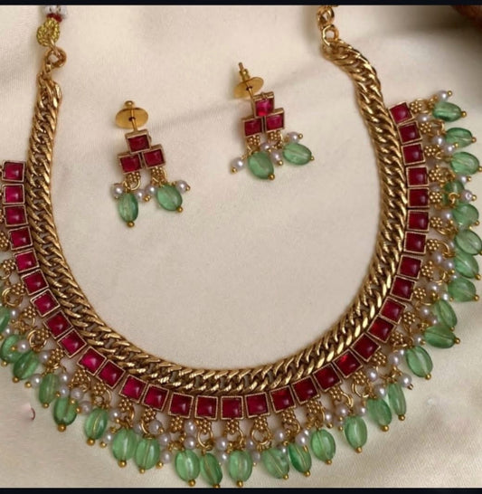 Green with ruby necklace