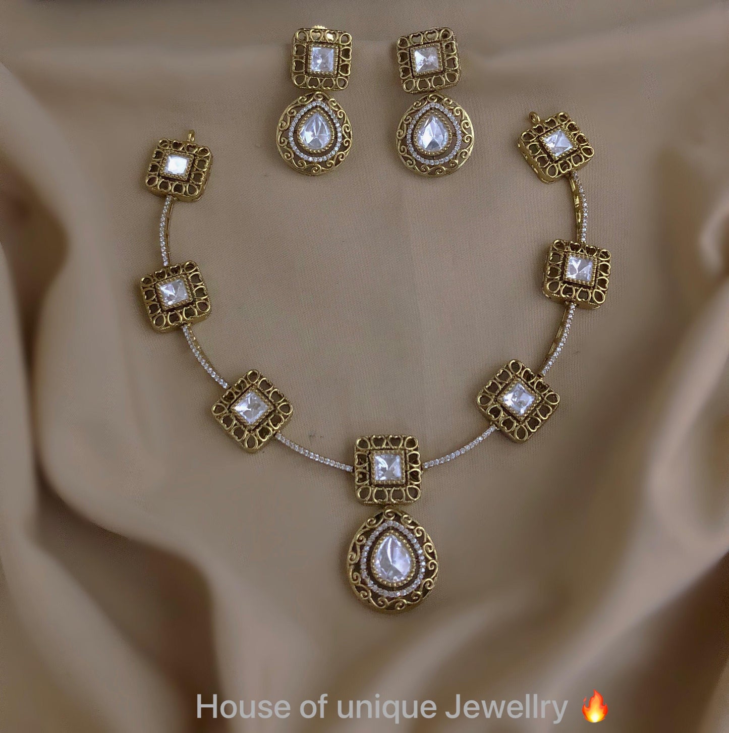 Gold with white stone necklace