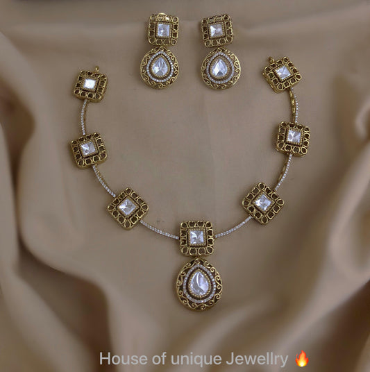 Gold with white stone necklace